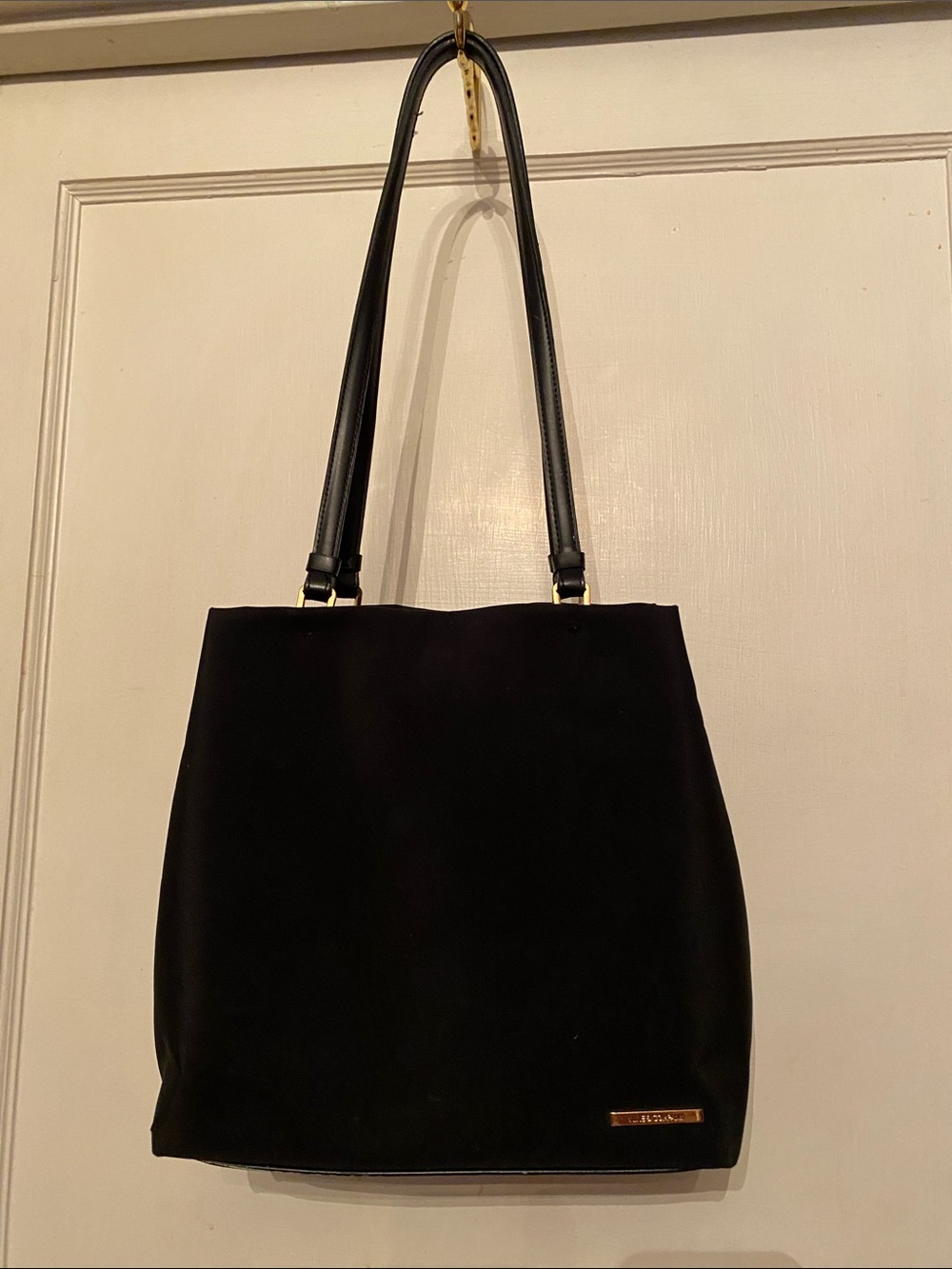 Nine company classic black shoulder bag featuring dual thin straps